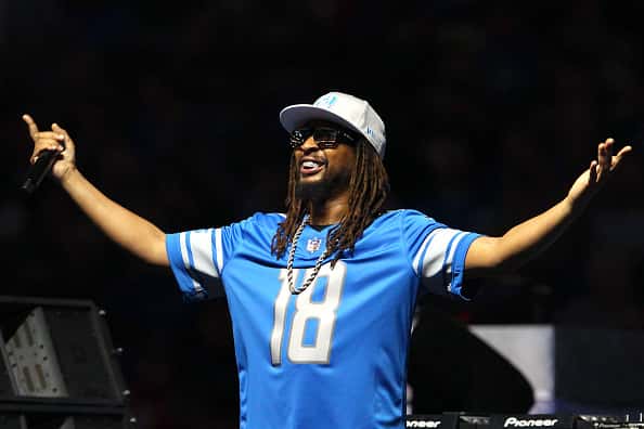 Lil Jon performing in blue 18 jersey