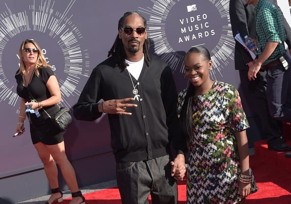 US musician Snoop Dogg (L) arrives with his daughter Cori Broadus on the red carpet for the 31st MTV Video Music Awards at The Forum in Inglewood