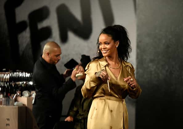 Rihanna walks on stage during her Fenty Beauty talk in collaboration with Sephora