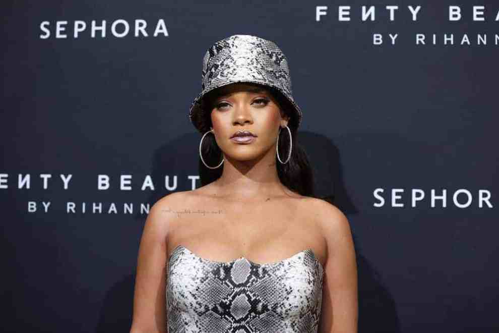Rihanna wearing snake skin hat and dress at Fenty Beauty by Rihana
