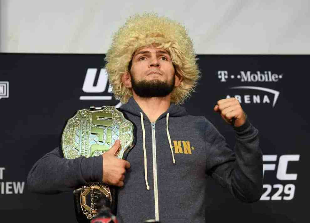 Khabib Nurmagomedov holding UFC championship belt after match