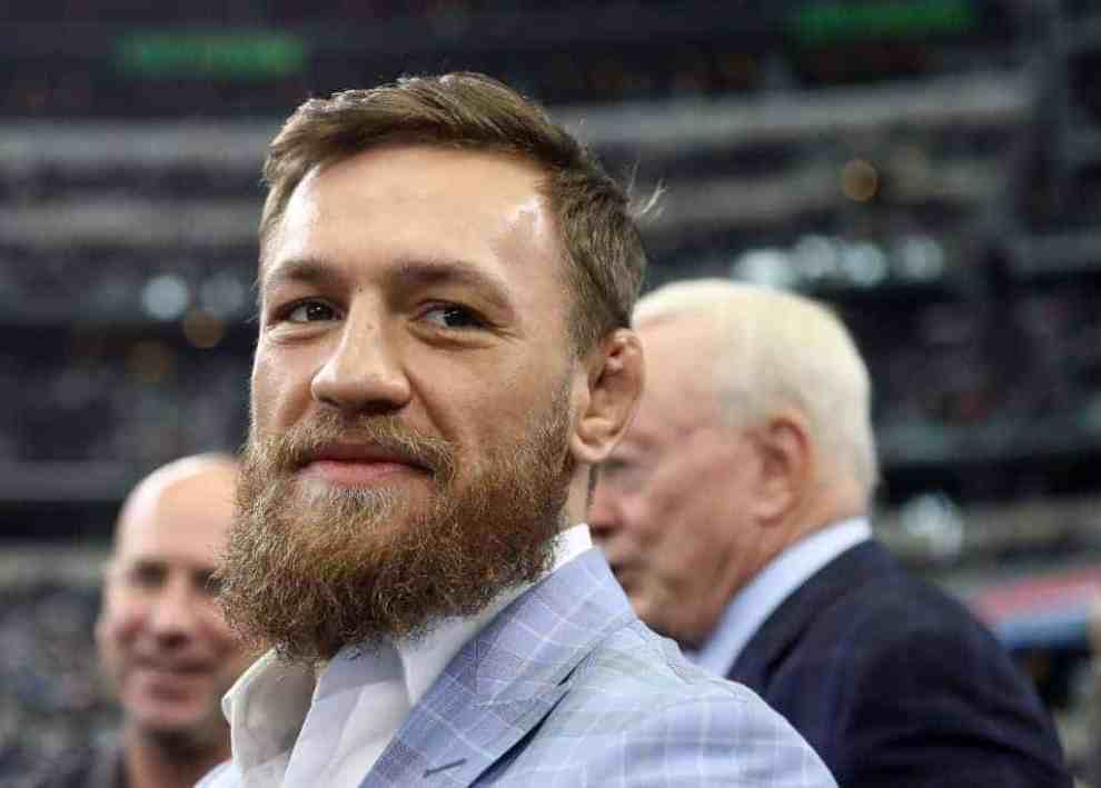 Connor McGregor wearing a light blue jacket