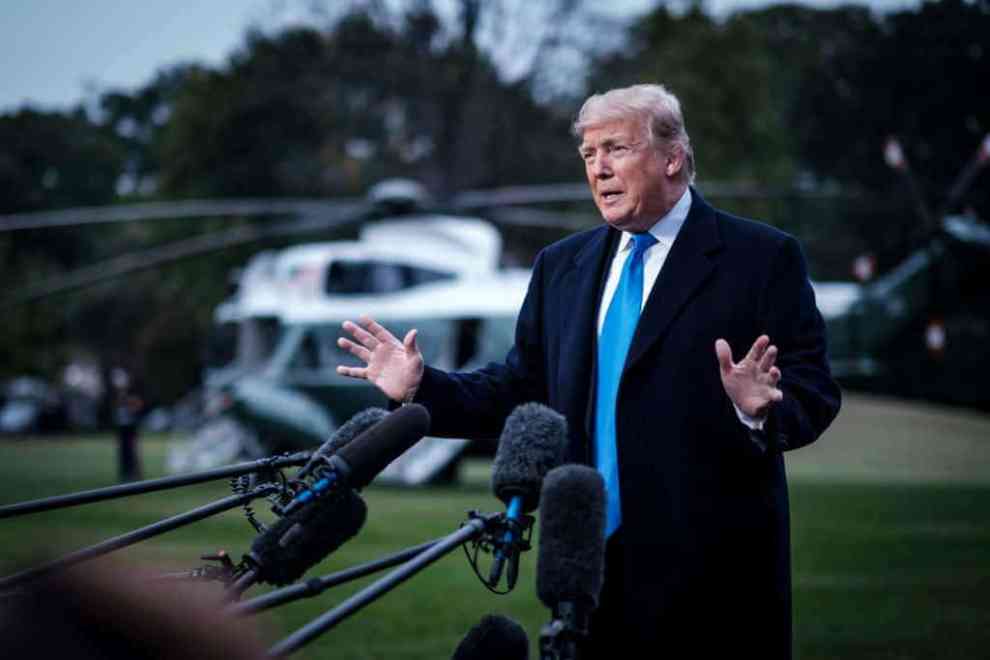 US President Donald Trump speaks to the media as he prepares to board Marine One on the South Lawn of the White House on October