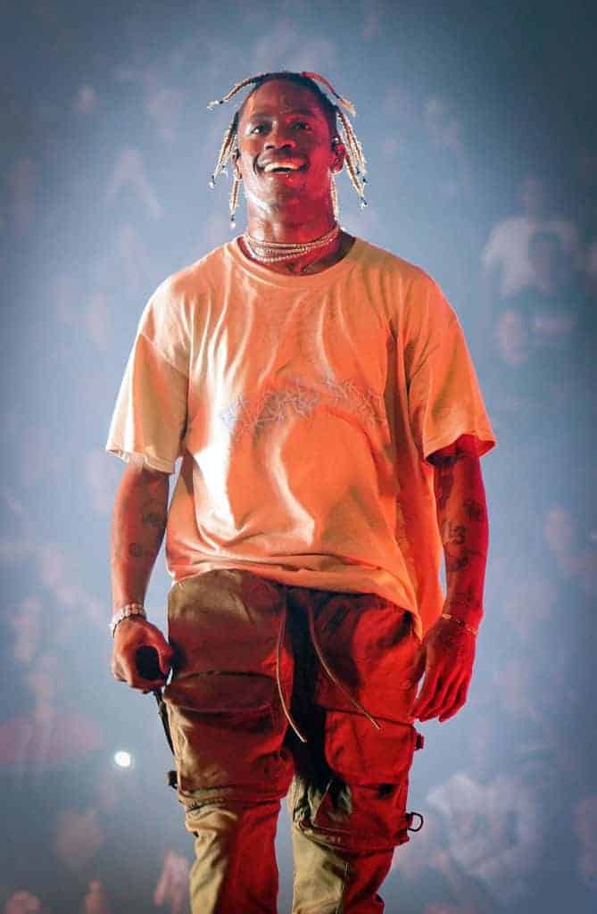 Travis Scott on stage wearing tan