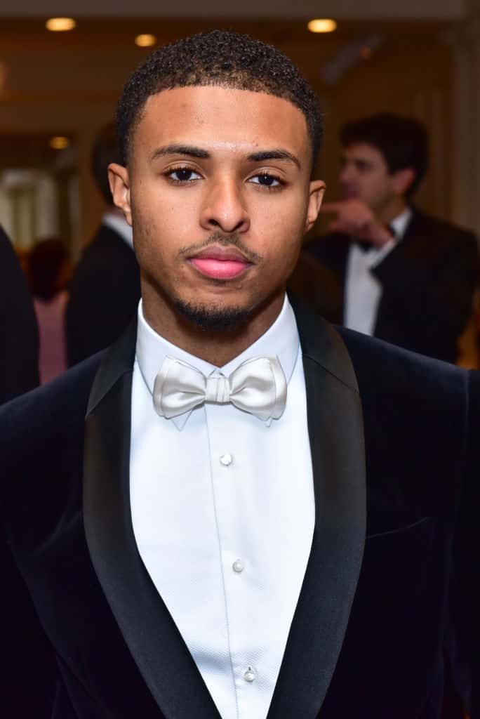 Diggy Simmons wearing black and white tux