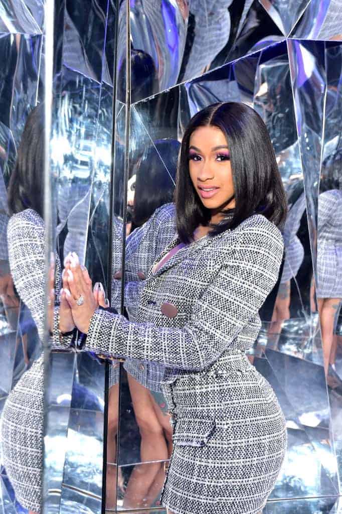 cardi B in suit with mirrors