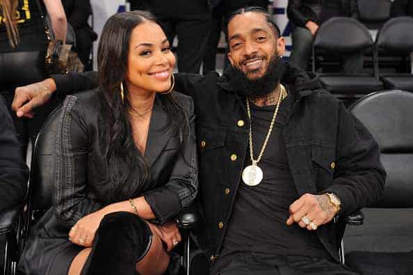 Nipsey Hussle and Lauren London attend a basketball game between the Los Angeles Lakers and the Portland Trail Blazers at Staple