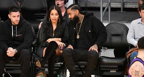 Nipsey Hussle and Lauren London attend a basketball game between the Los Angeles Lakers and the Portland Trail Blazers at Staples Center on November 14