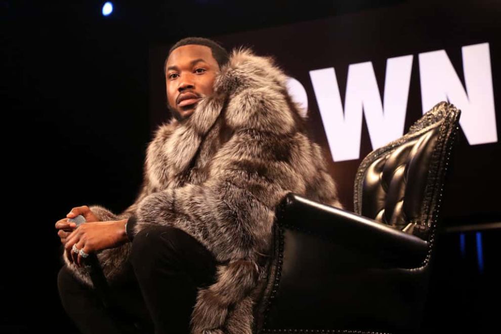 Meek Mill wearing black and grey fur coat
