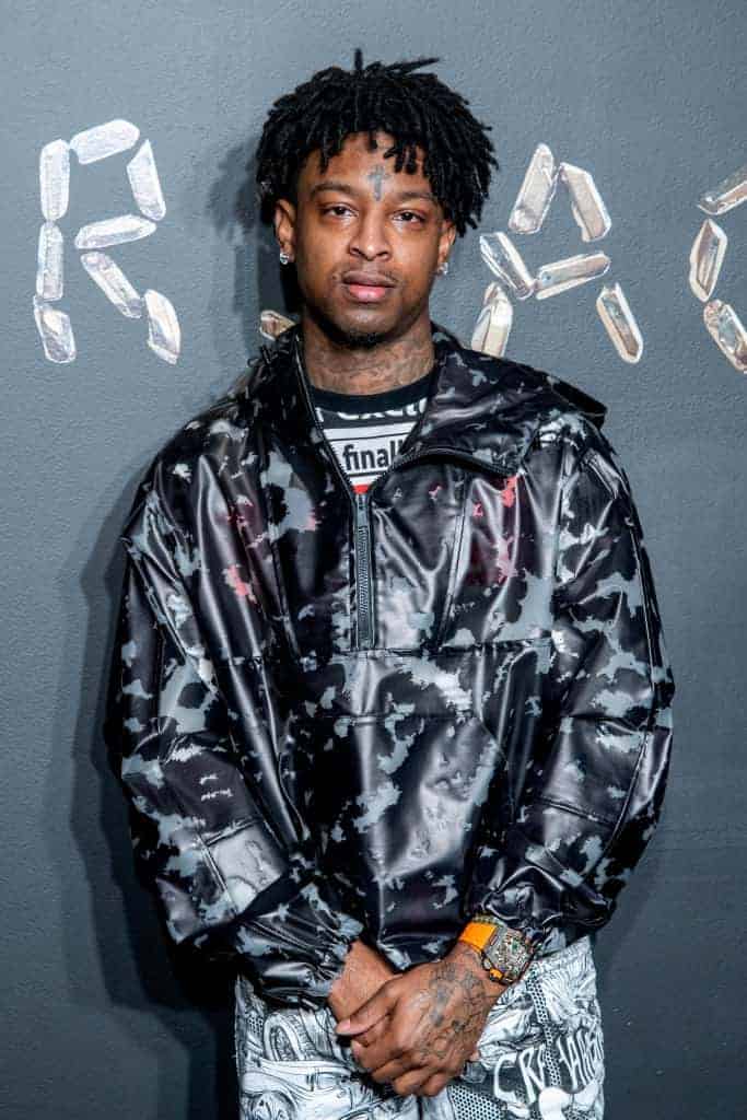 21 Savage wearing black and silver jacket