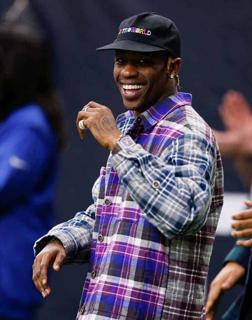 Travis Scott watches the Indianapolis Colts and Houston Texans during the Wild Card Round at NRG Stadium on January 05