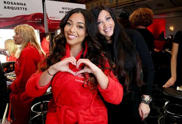 Jordyn Woods and Elizabeth Woods pose backstage during The American Heart Association's Go Red for Women Red Dress Collection 20