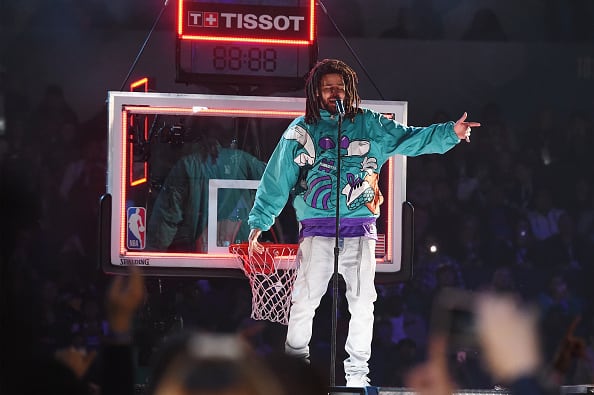 J. Cole performs at halftime during the 68th NBA All-Star Game at Spectrum Center on February 17