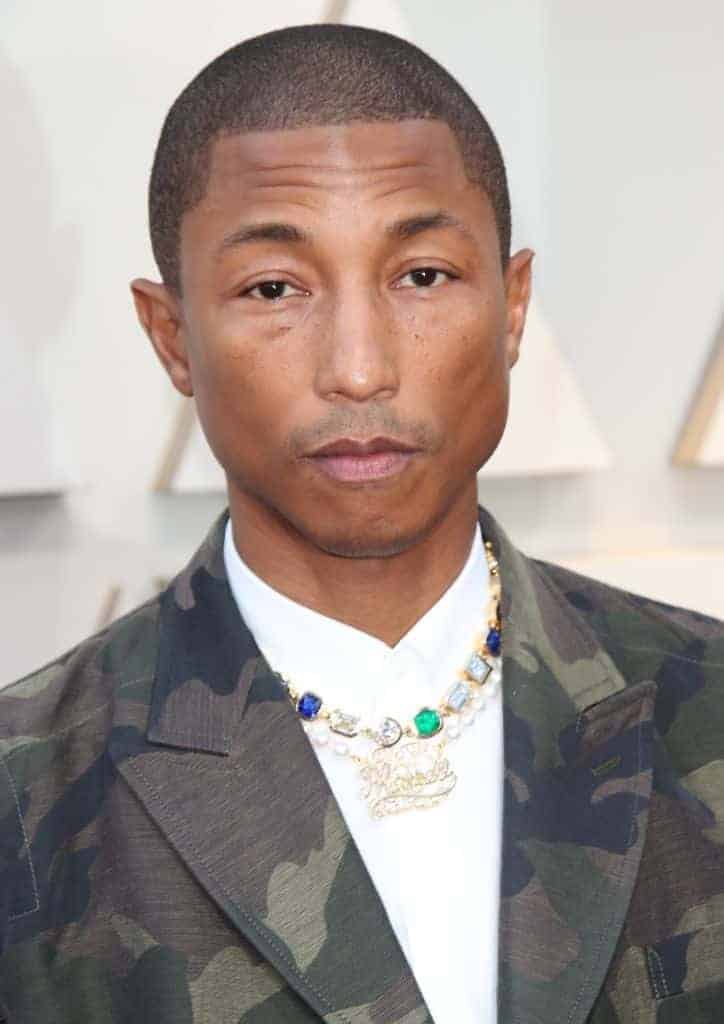 Pharrell staring at the children