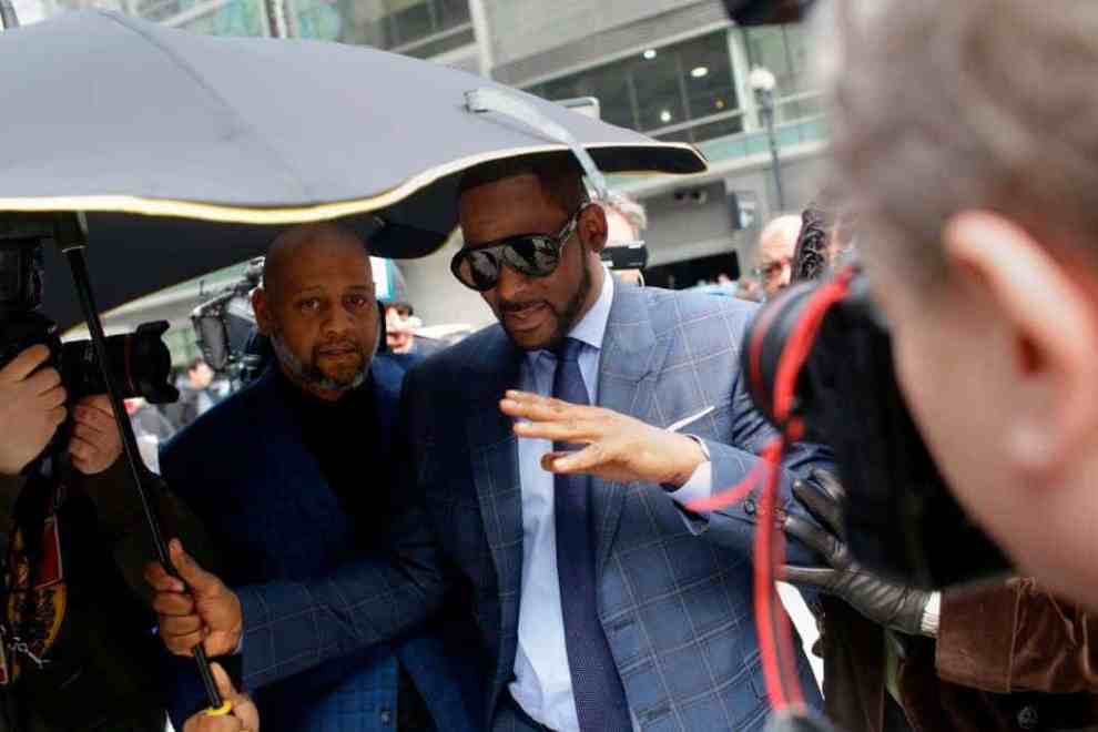 R. Kelly pushing away cameras
