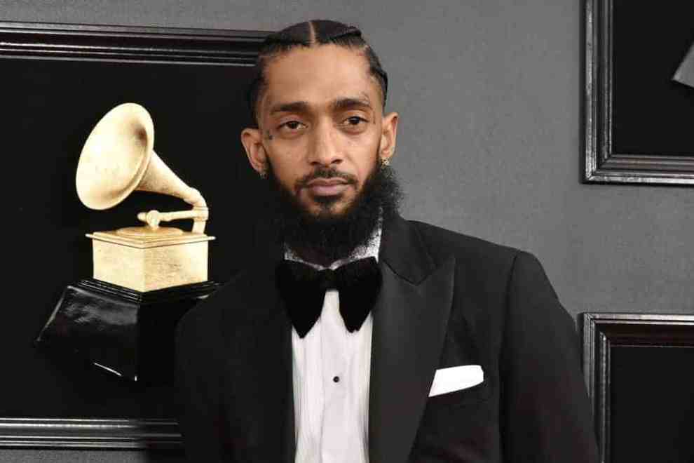Nipsey Hussle wearing a black and white tux