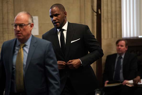Singer R. Kelly appears in court with his attorney Steve Greenberg (L) for a hearing to request that he be allowed to travel to