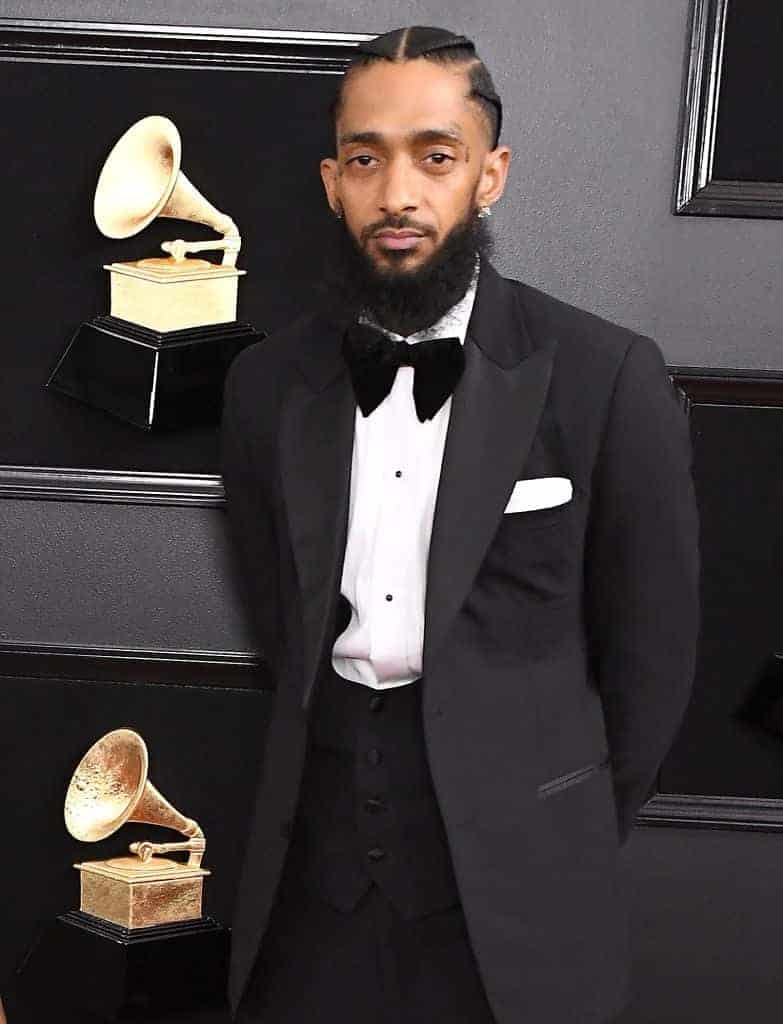 Nipsey Hussle wearing a black and white tux
