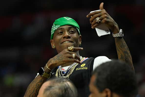 Rapper Soulja Boy takes selfies during a game between the Los Angeles Clippers and Chicago Bulls at Staples Center on March 15