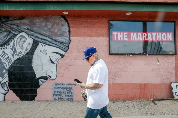 Fans and community members gather along the procession route for Nipsey hustle following his memorial at the Staples Center in Los Angeles