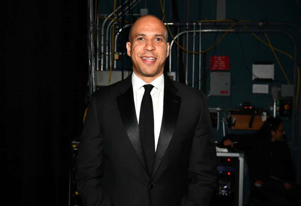 Cory Booker wearing a black suit