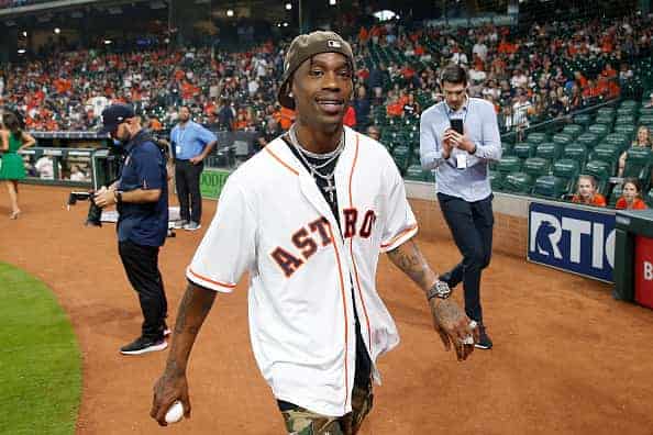 Rap Artist Travis Scott reacts after throwing the first pitch before the game between the Houston Astros and the Oakland Athletics at Minute Maid Park on April 6