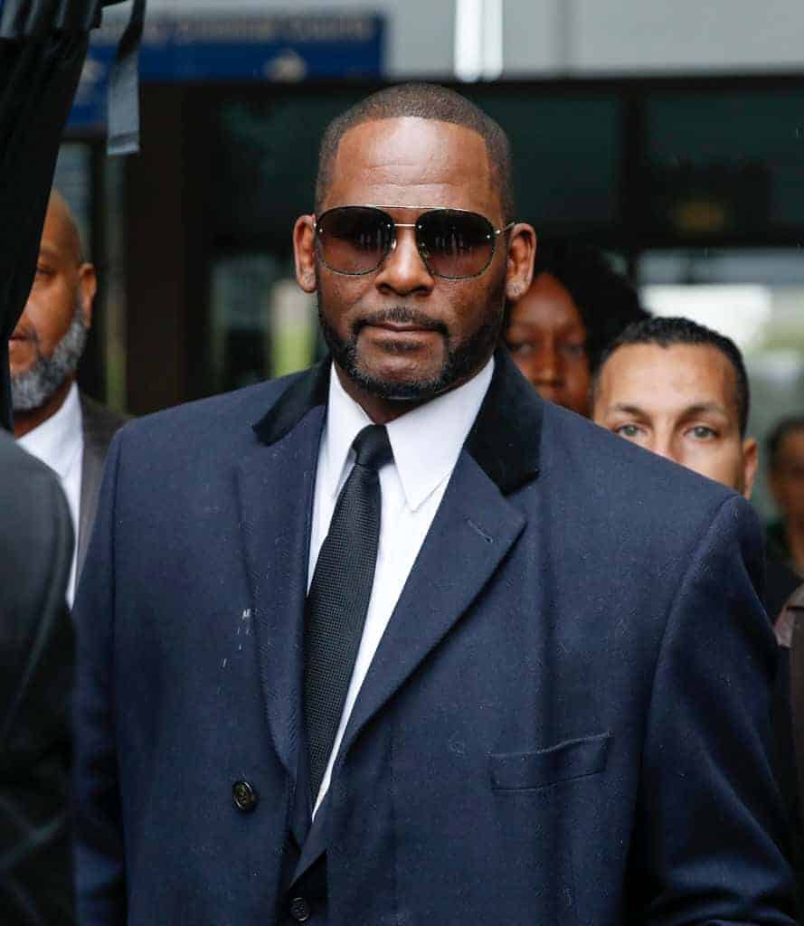 Photo of R Kelly wearing shades and a suit