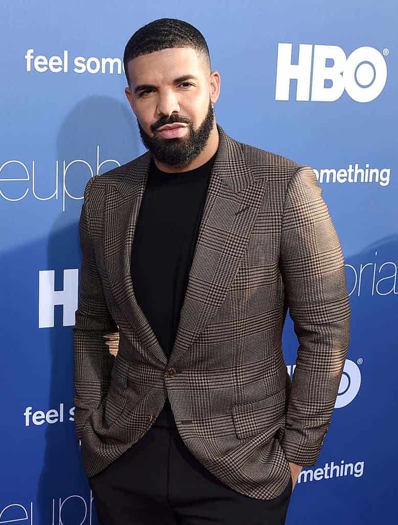 Drake wearing a suit