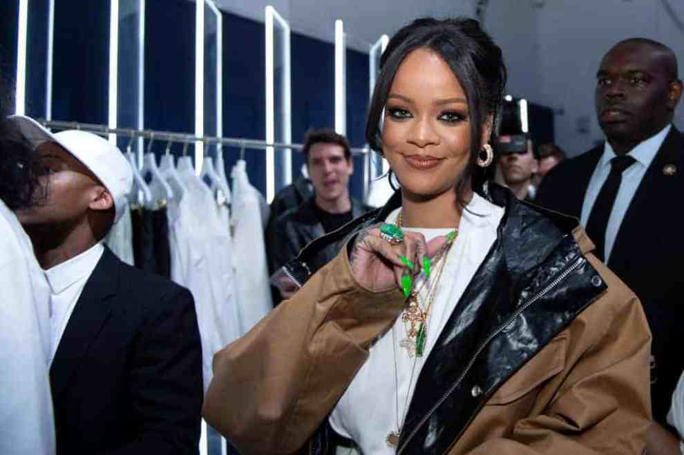 Rihanna wearing a brown jacket