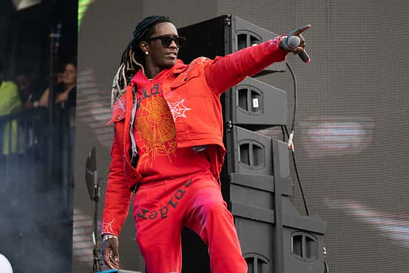 Young thug on stage performing wearing all red