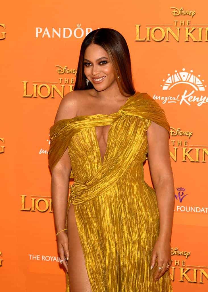 Beyonce wearing a gold dress