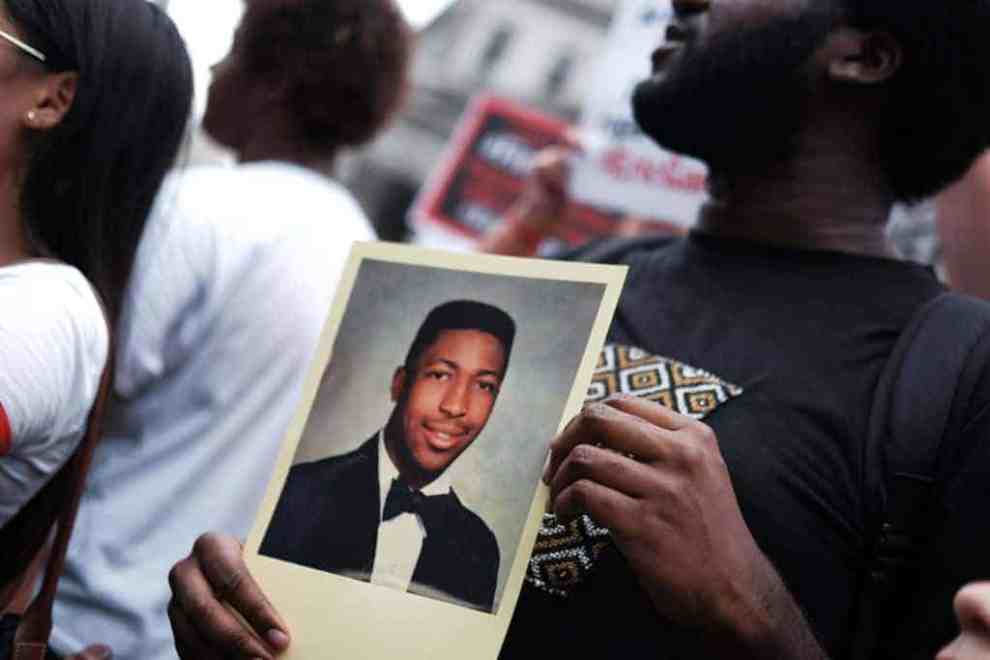 A Photo of Eric Garner held by a protester