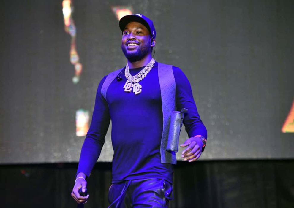 Meek Mill on stage smiling