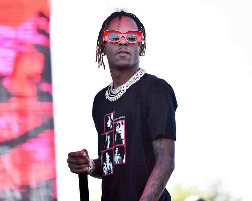 Rich the Kid wearing black with red glasses