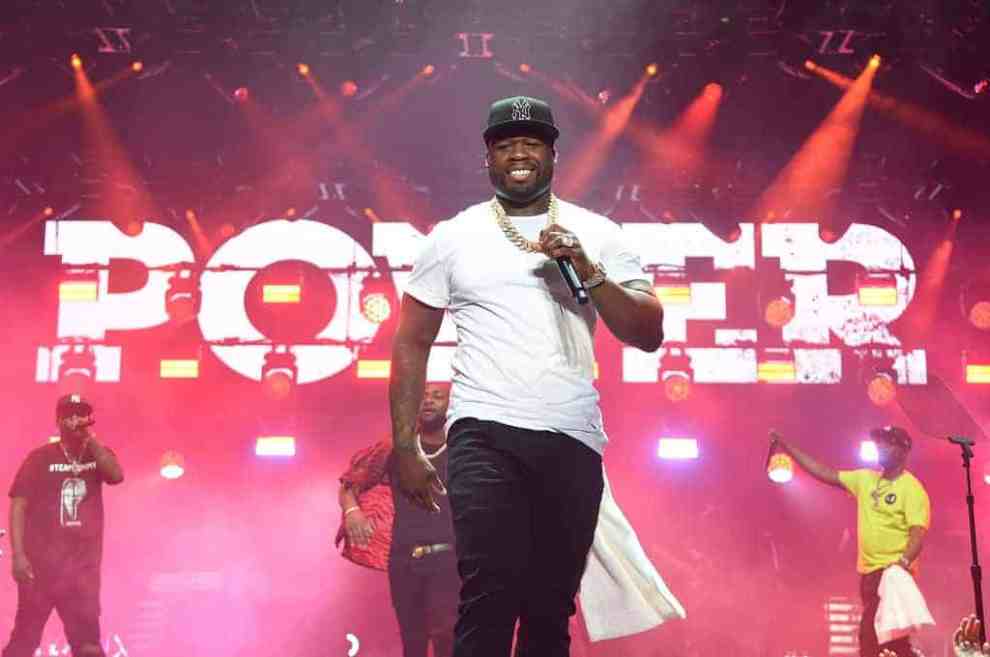 50 cent on stage wearing white and black