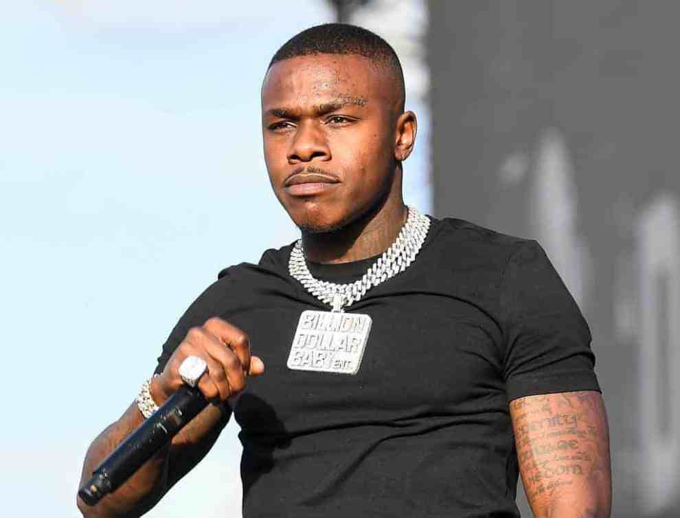 DaBaby on stage wearing a black shirt
