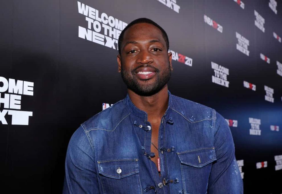 Dwyane Wade wearing a blue shirt