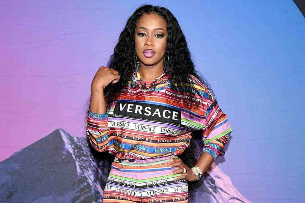 Remy Ma wearing a mutli-colored outifit