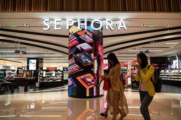 2019/10/05: Pedestrians walk past a Sephora outlet in Shenzhen. A French multinational chain of personal care and beauty stores.