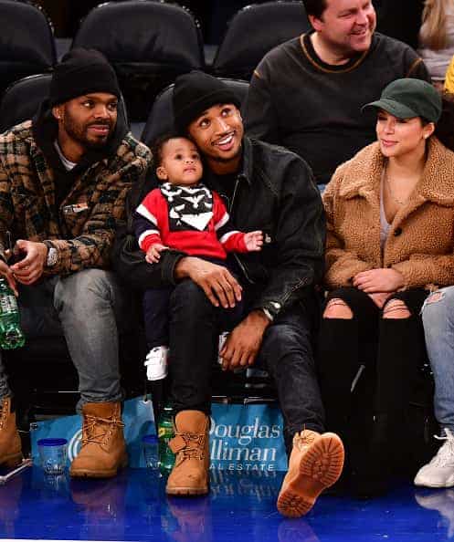 Trey Songs and his son at a basketball game|