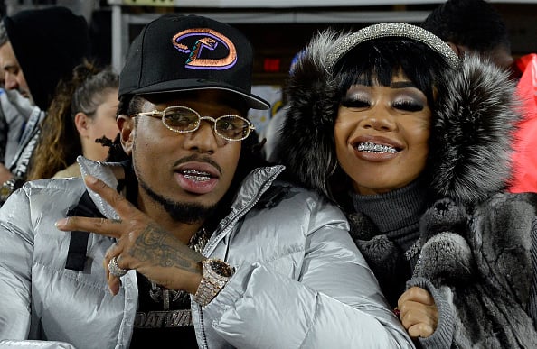 Rapper Quavo of Migos and Saweetie attend a football game between Baltimore Ravens and Los Angeles Rams at Los Angeles Memorial Coliseum on November 25