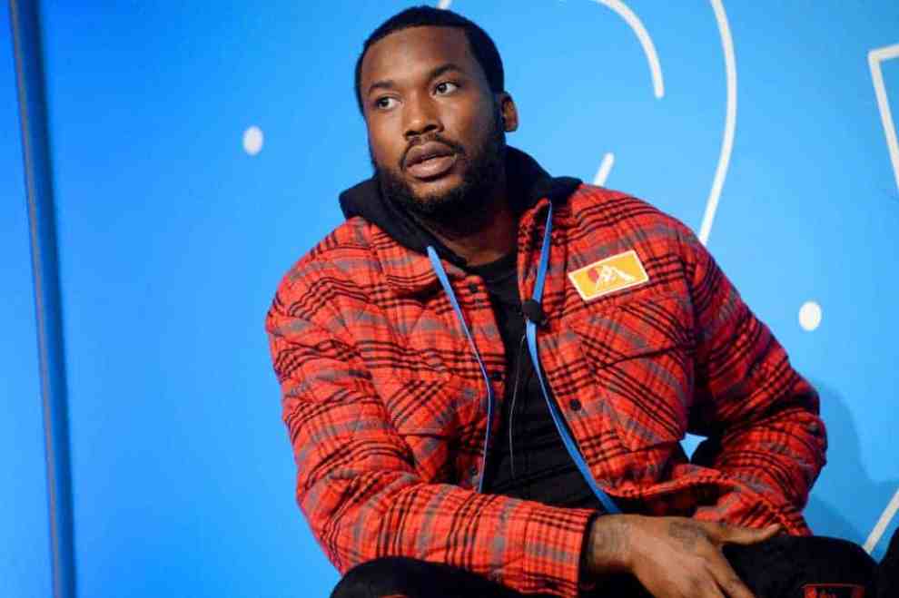 Meek Mill wearing red plaid jacket