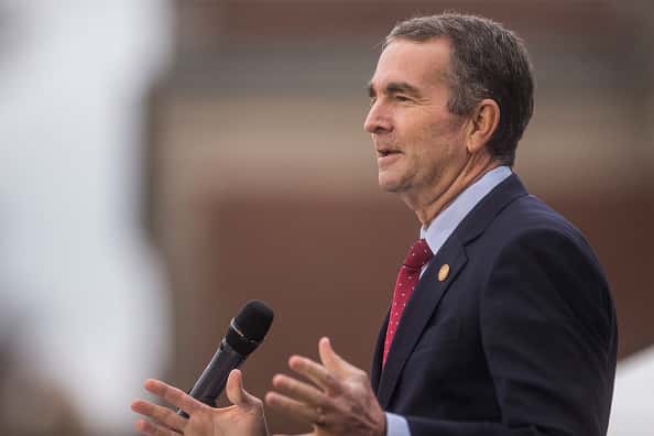 Virginia Gov. Ralph Northam speaks during an unveiling ceremony for Rumors of War
