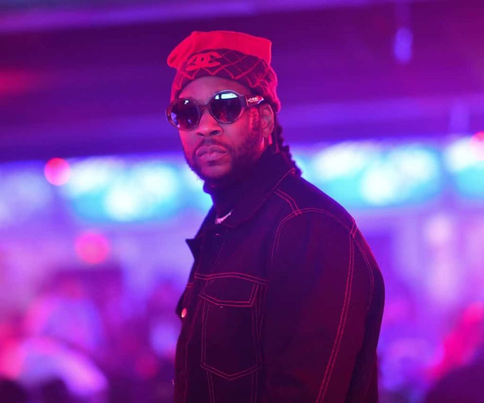 2 Chainz wearing Sunglasses and black jacket