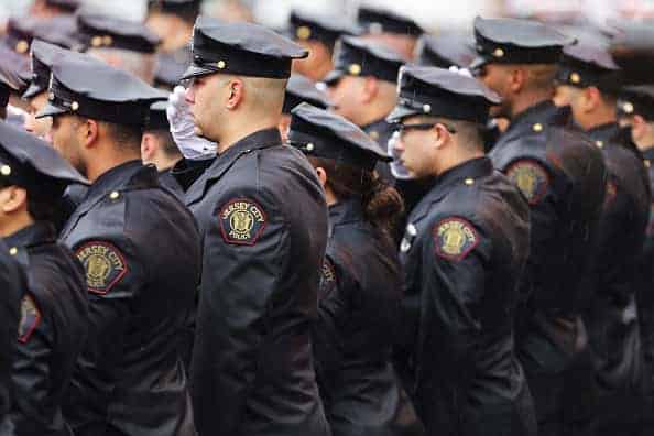 Thousands of police officers gather in the rain for the funeral service for New Jersey Detective Joseph Seals
