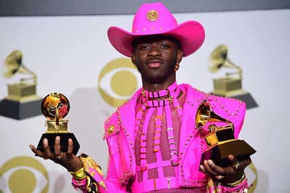 US rapper Lil Nas X poses in the press room with the awards for Best Music Video and Best Pop Duo/Group Performance during the 62nd Annual Grammy Awards on January 26