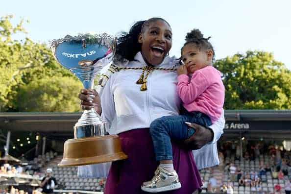 Serena Williams of the USA celebrates with daughter Alexis Olympia after winning the final match against Jessica Pegula of USA a