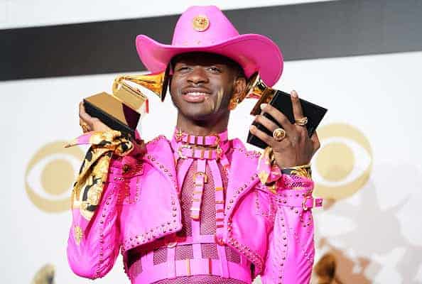 Lil Nas X poses in the press room with the awards for Best Music Video and Best Pop Duo/Group Performance during the 62nd Annual