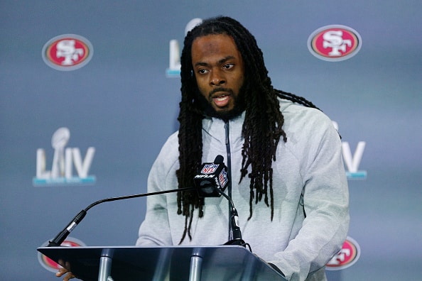 Richard Sherman #25 of the San Francisco 49ers speaks to the media during the San Francisco 49ers media availability prior to Super Bowl LIV at the James L. Knight Center on January 29