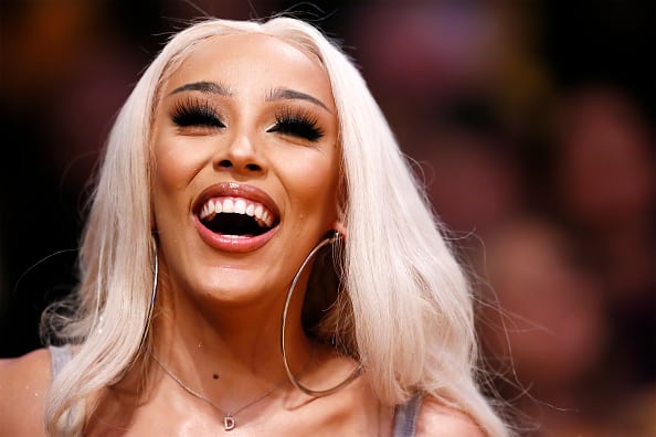 Singer Doja Cat looks on during a game at the Staples Center on March 10